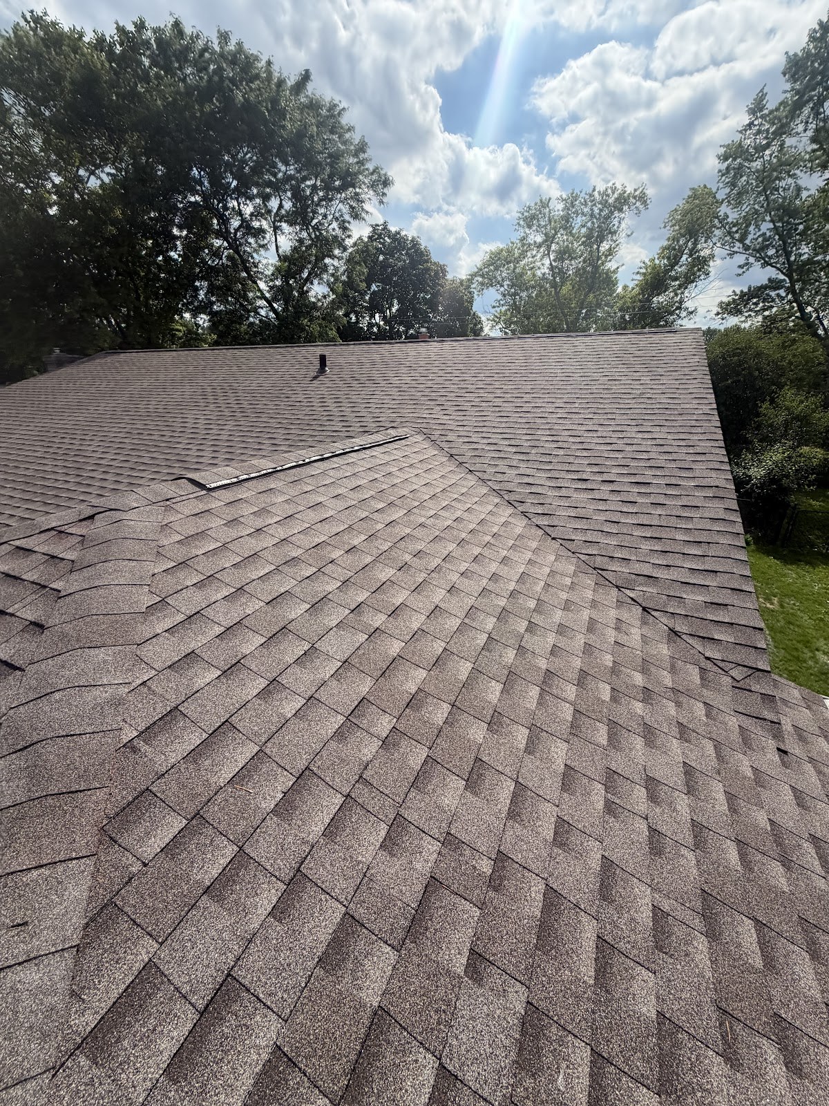 Completed asphalt shingle roof with clean valleys in Southfield